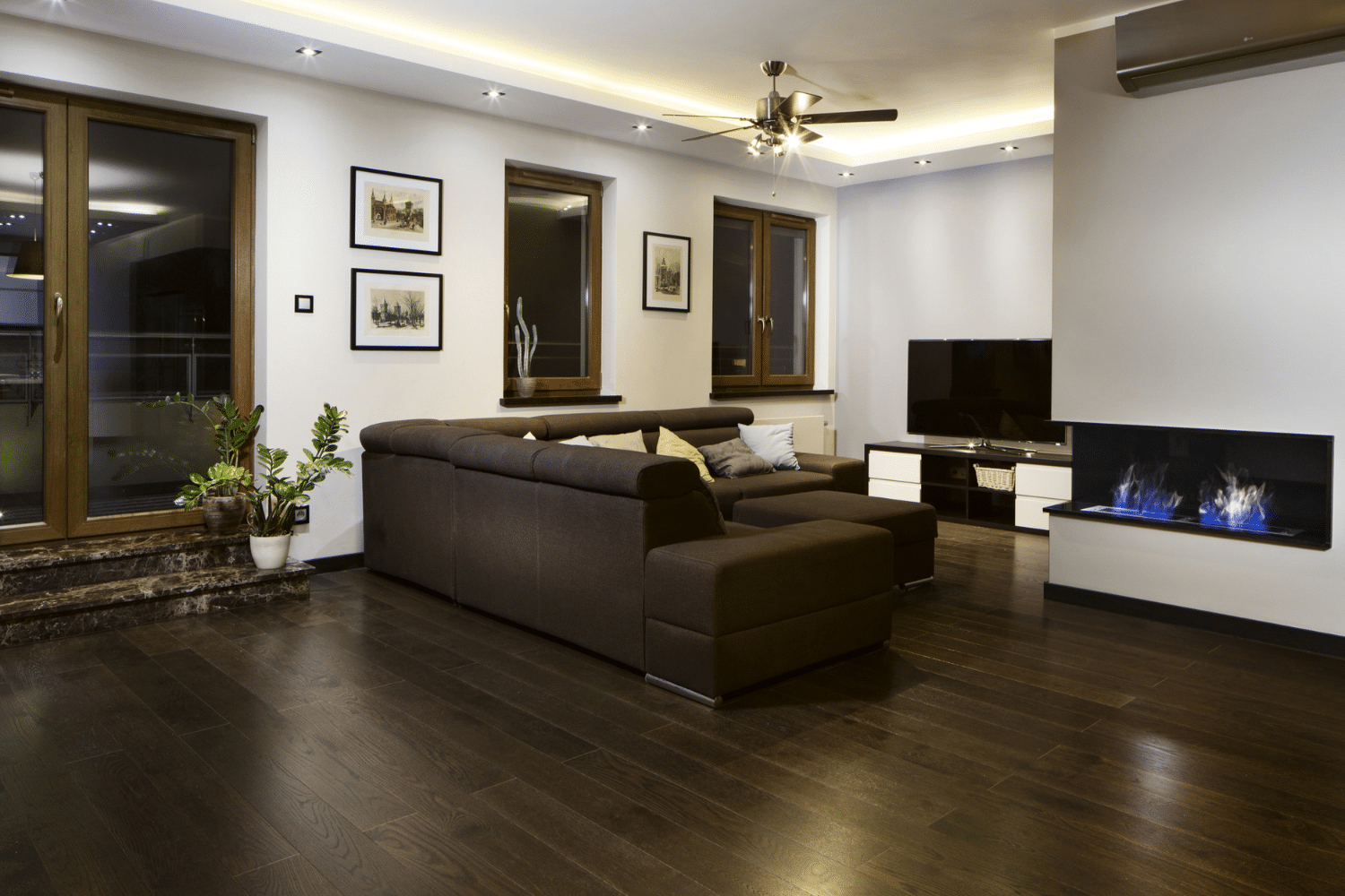 brown hardwood floors with pale/white colored walls