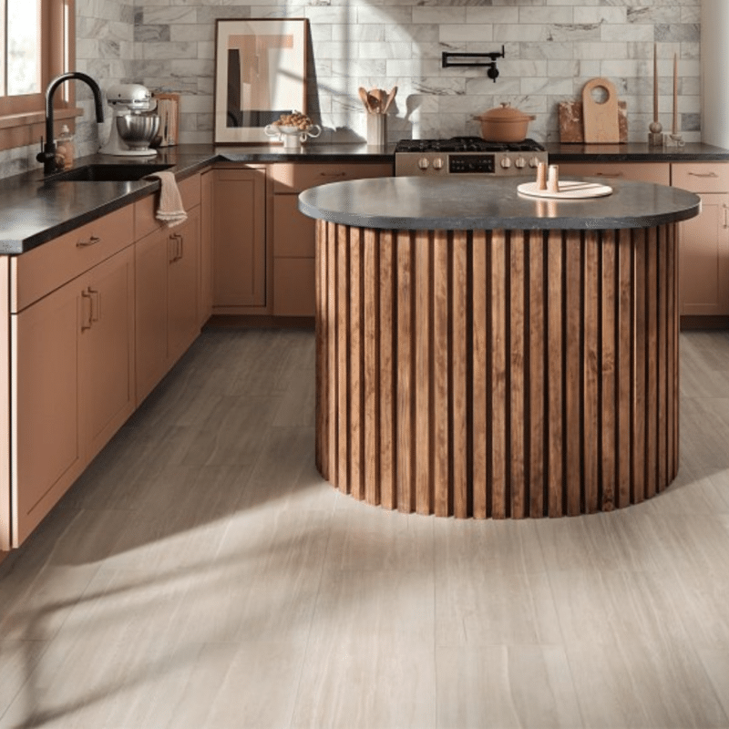 a kitchen with a round island