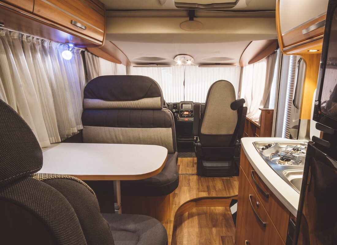 camper RV interior with laminate wood flooring