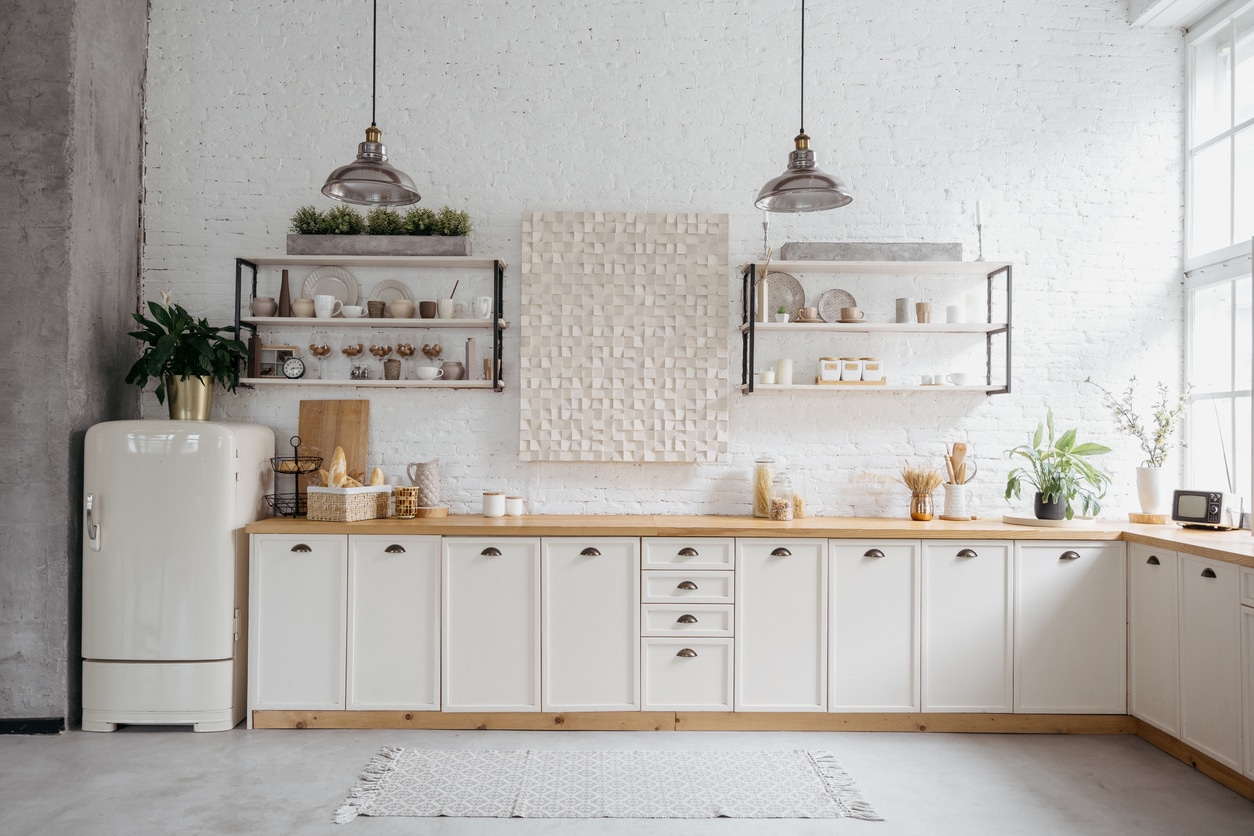 vintage style kitchen with wood worktops and concrete tile floors