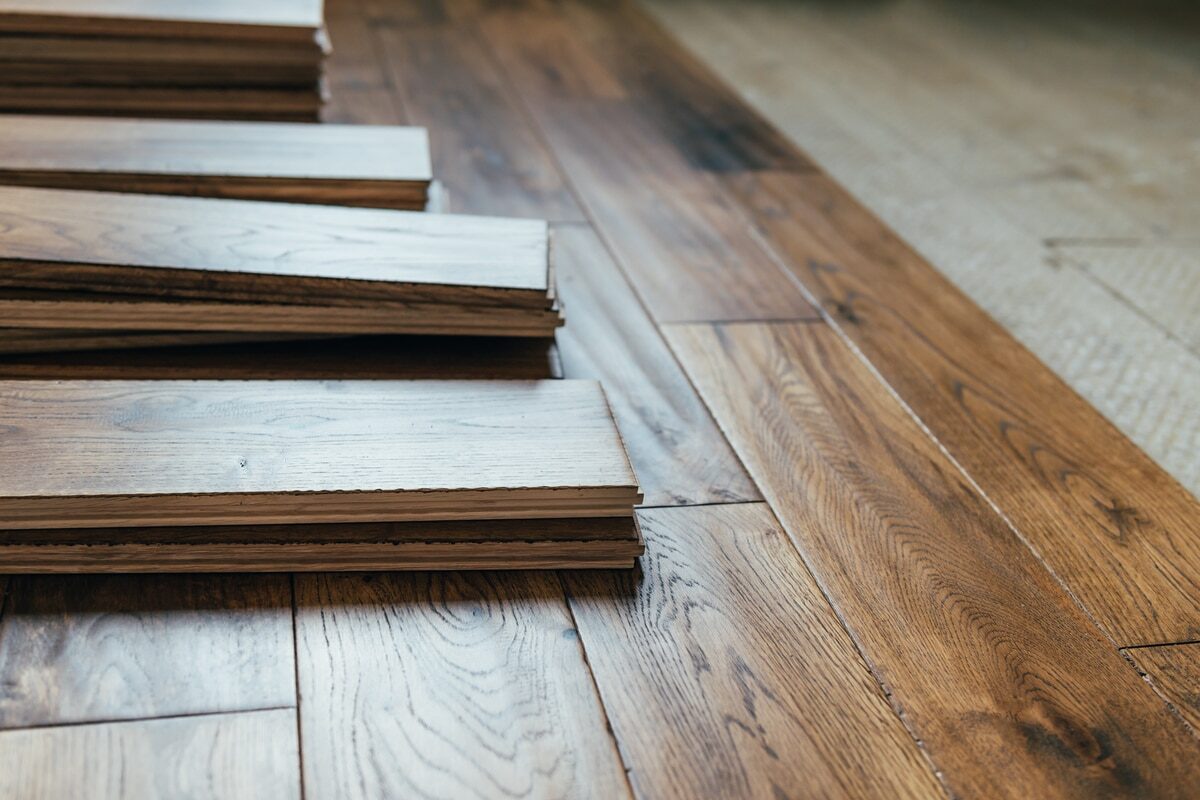 a close up of hardwood floors being installed in a home