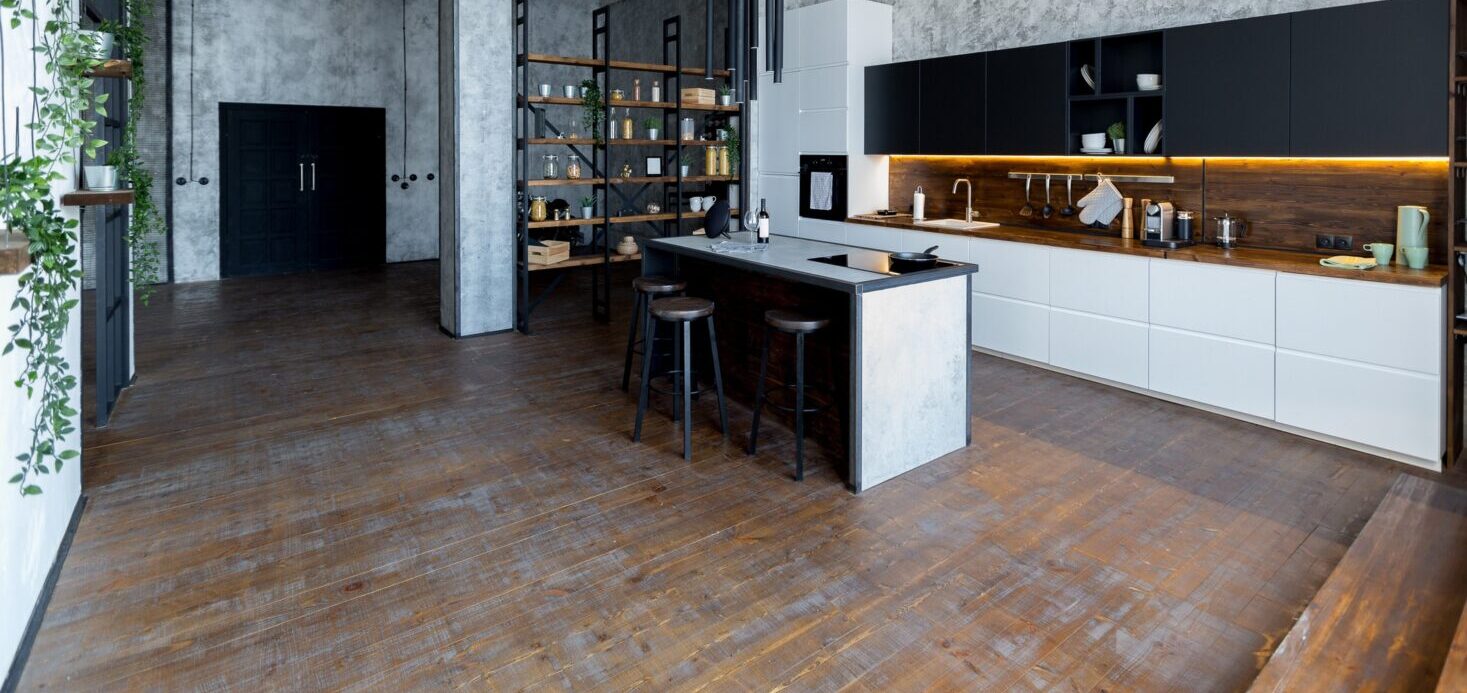 a retro kitchen with distressed hardwood floors