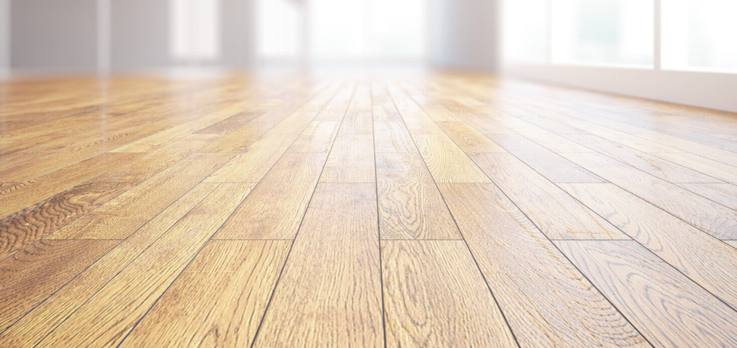 close up of light hardwood floors in a bright room interior