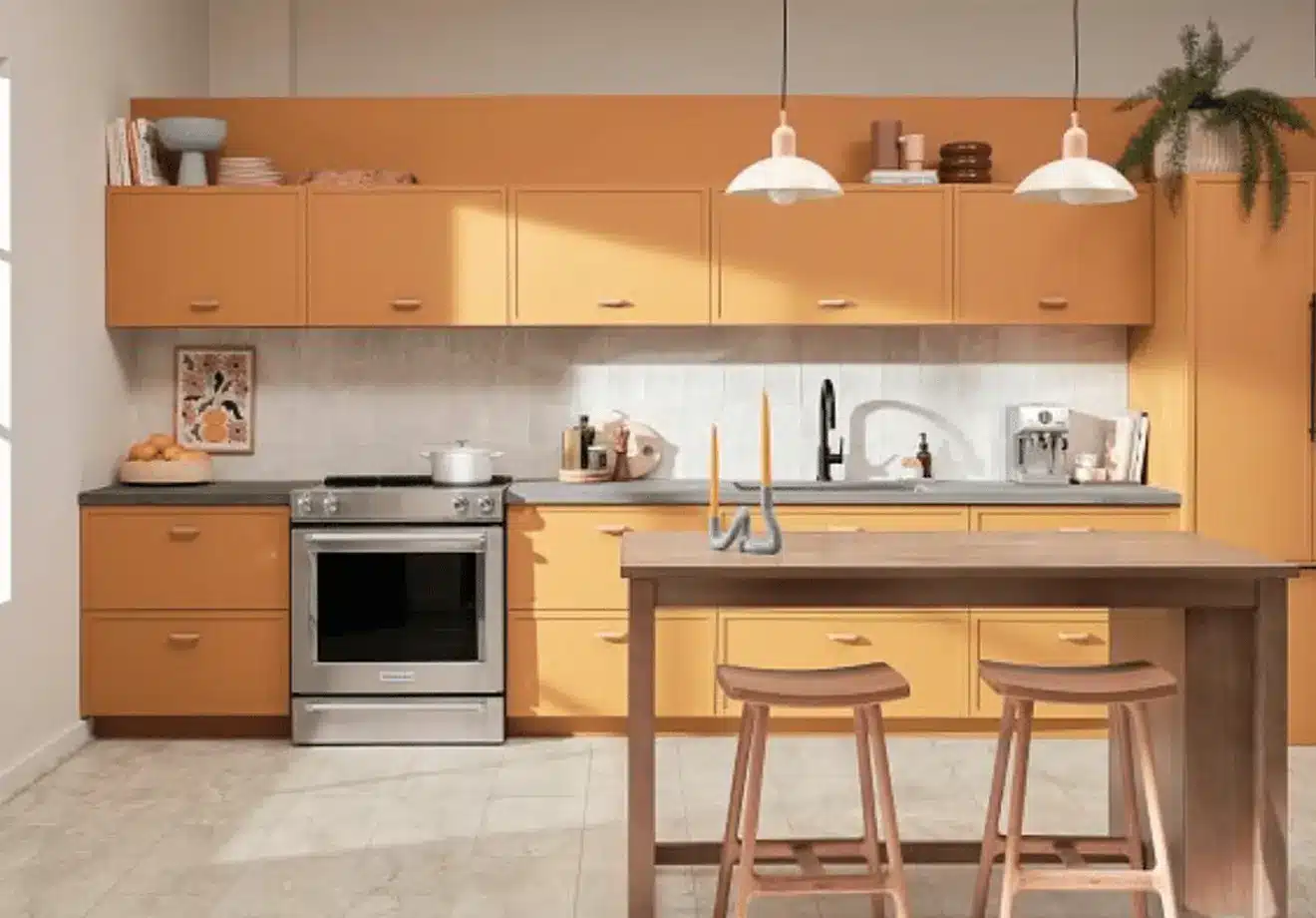 Light-stone LVT flooring in bright modern kitchen with orange cabinets
