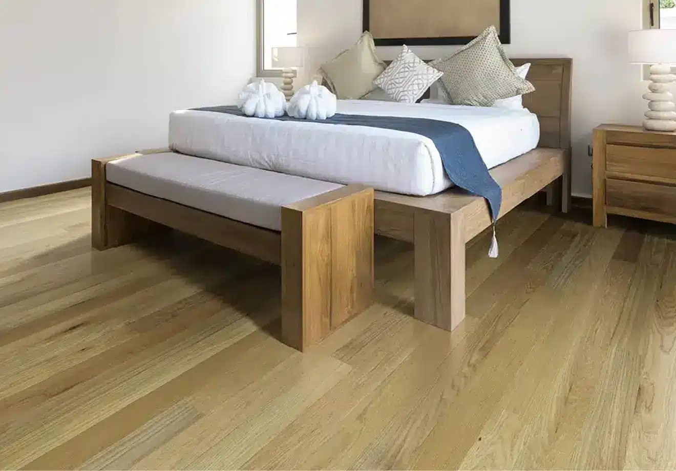 Waterproof natural wood flooring in serene bedroom with platform bed