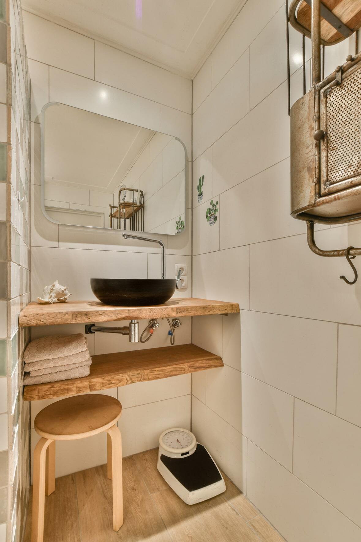 a small bathroom with wood-look vinyl floor tiles