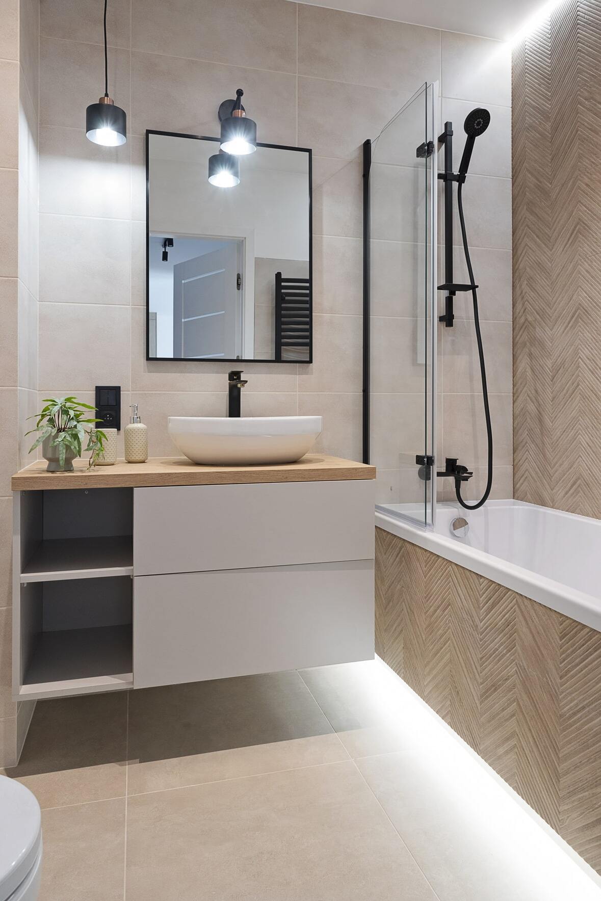 a smaller bathroom with travertine look floor tiles