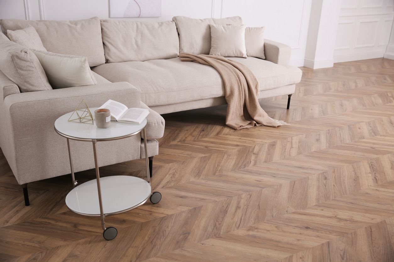 herringbone vinyl plank flooring laid in a living room