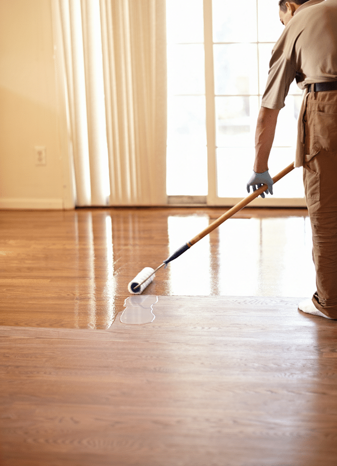hardwood floor finish applicator on hardwood floor
