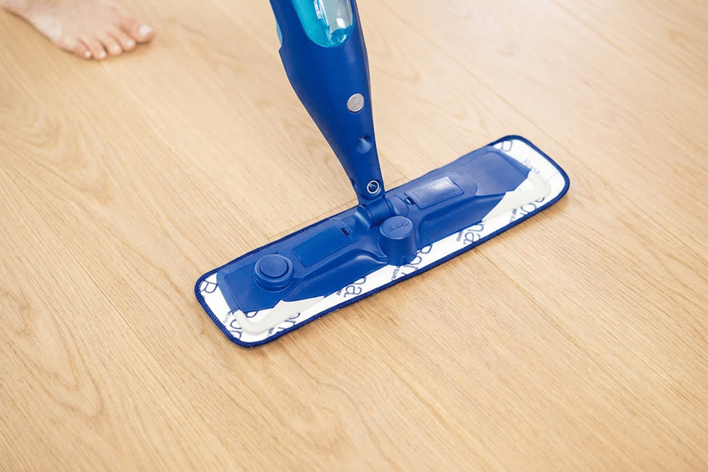 hardwood floor maintenance and mopping on a white oak floor