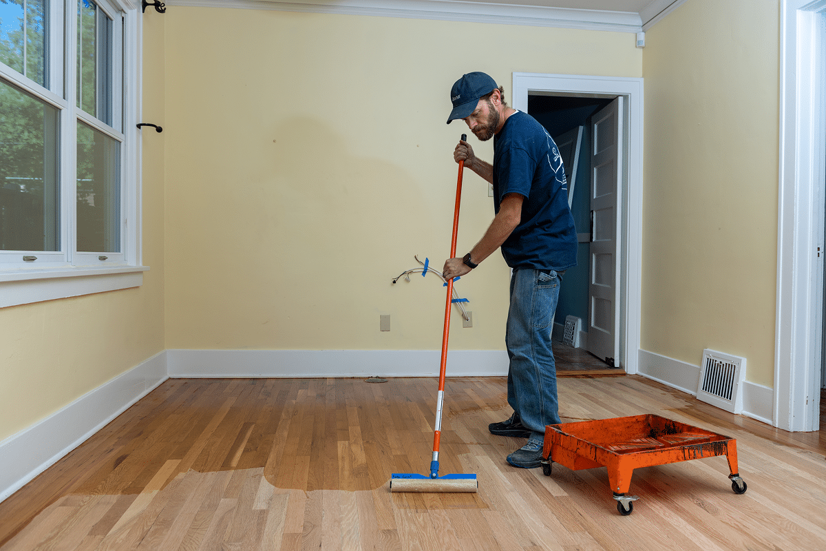 applying water-based polyurethane to a hardwood floor