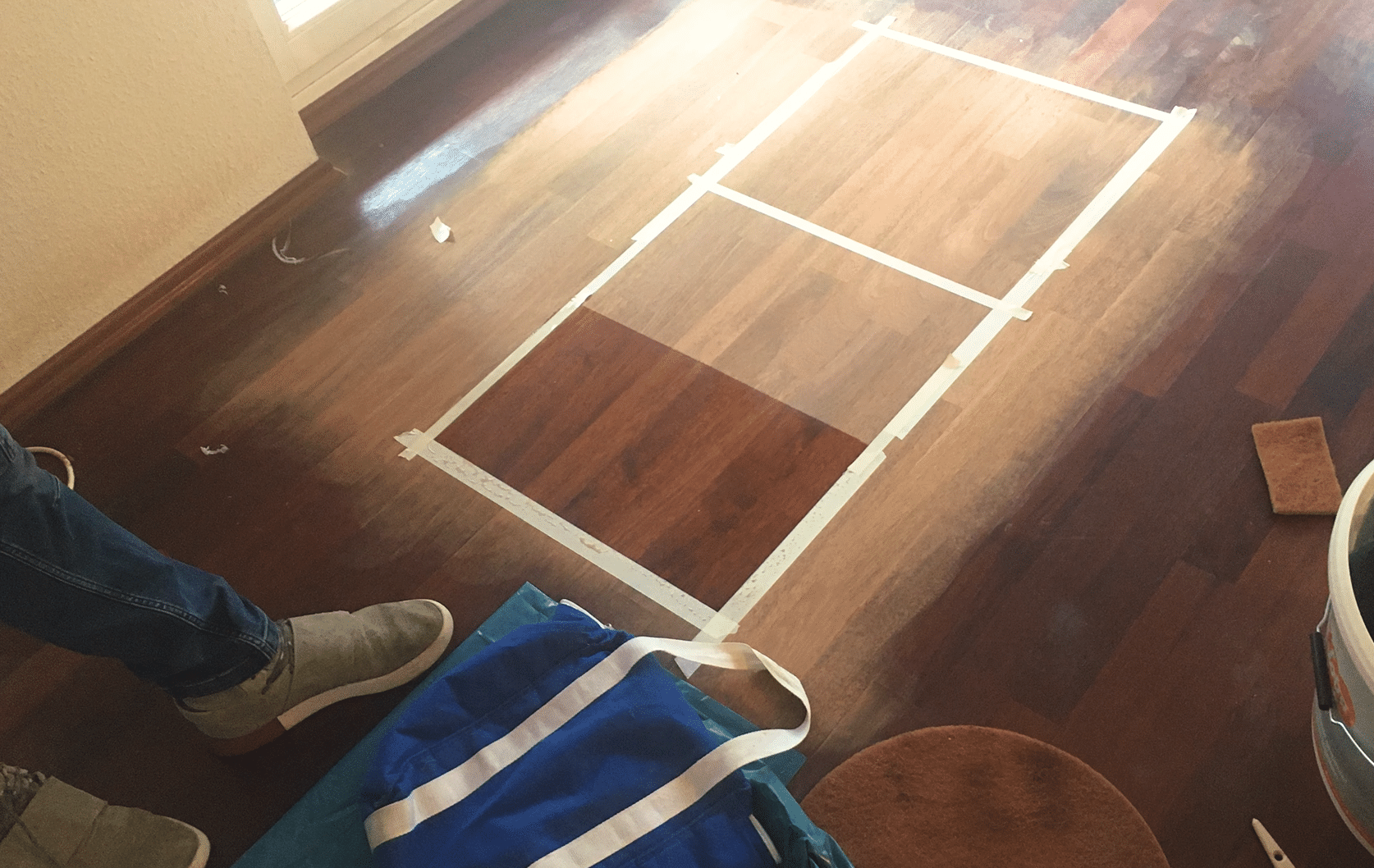 hardwood pros stain samples on floor
