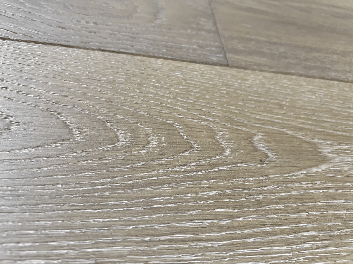 wire brushed beige hardwood sample with cathedrals from panel town show room