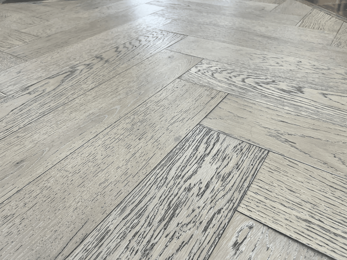 wire-brushed herringbone hardwood floor