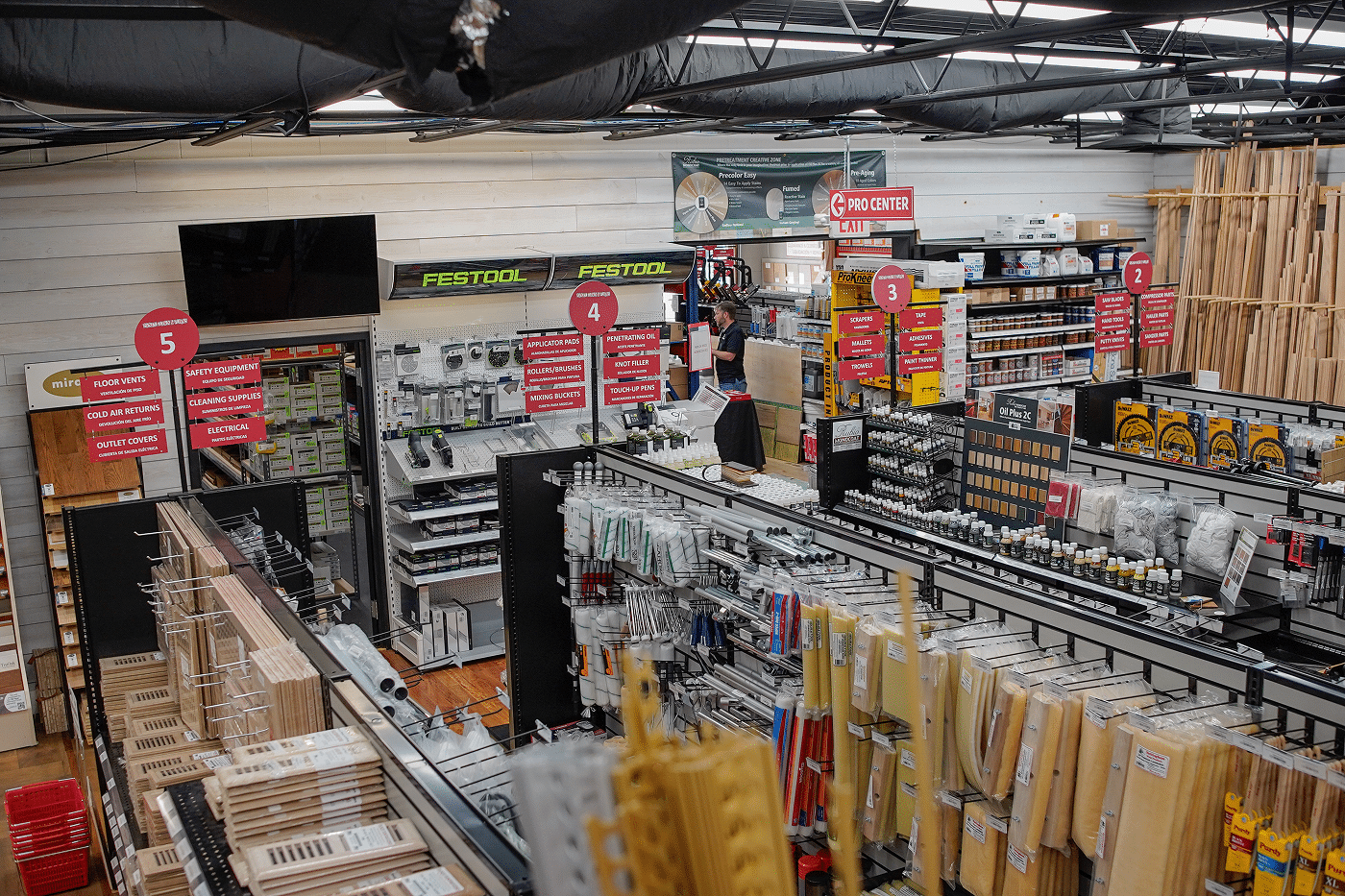 an inside view of our pro shop with applicators, sandpaper in the back, tools, and everything else you need for a flooring project