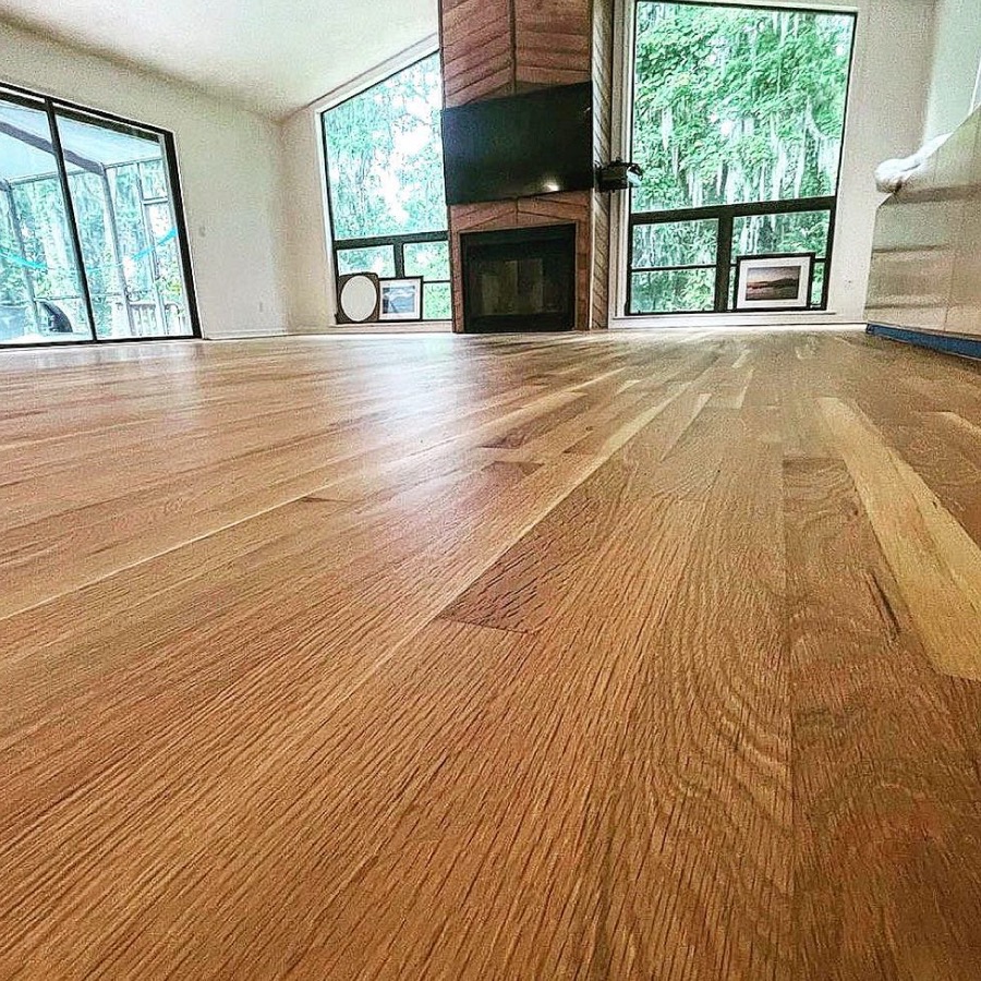 refinished oak floor empty room